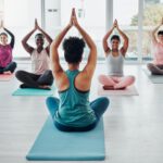 Diversity women in yoga class for meditation exercise for fitness, peace and wellness. Group and in